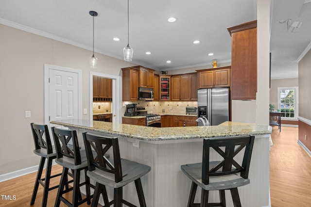 3608 Smoky Chestnut Ln, Raleigh, NC 27615 - kitchen with stainless steel appliances, ornamental molding, brown cabinetry, backsplash, and light wood-type flooring