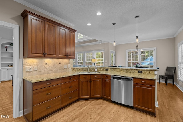 3608 Smoky Chestnut Ln, Raleigh, NC 27615 - kitchen with dishwasher, light wood-style floors, light stone countertops, a peninsula, and a textured ceiling
