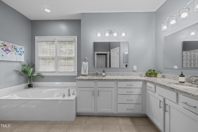 3608 Smoky Chestnut Ln, Raleigh, NC 27615 - full bathroom featuring double vanity, a garden tub, and tile patterned floors