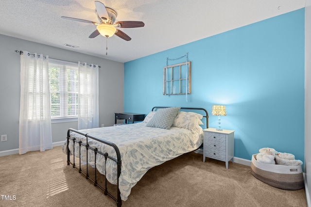 3608 Smoky Chestnut Ln, Raleigh, NC 27615 - bedroom with carpet floors, a ceiling fan, and a textured ceiling