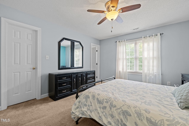 3608 Smoky Chestnut Ln, Raleigh, NC 27615 - bedroom with light colored carpet, a textured ceiling, and a ceiling fan