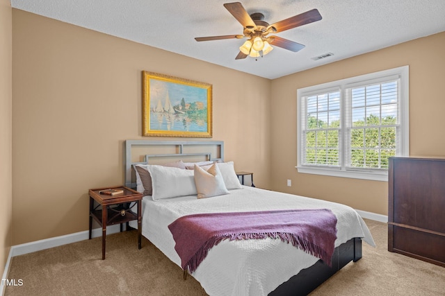 3608 Smoky Chestnut Ln, Raleigh, NC 27615 - bedroom featuring carpet flooring, a textured ceiling, and a ceiling fan