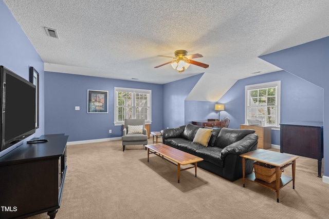 3608 Smoky Chestnut Ln, Raleigh, NC 27615 - living room with light colored carpet, a textured ceiling, plenty of natural light, and a ceiling fan