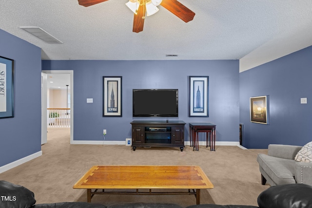 3608 Smoky Chestnut Ln, Raleigh, NC 27615 - living room featuring carpet flooring, ceiling fan, and a textured ceiling