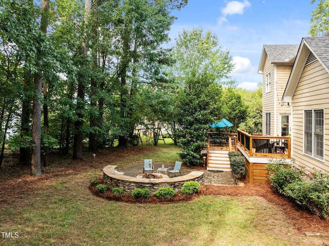 3608 Smoky Chestnut Ln, Raleigh, NC 27615 - view of grassy yard featuring a fire pit and a deck