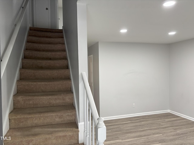 1405 Highview Ct, Raleigh, NC 27606 - stairway featuring wood finished floors and recessed lighting