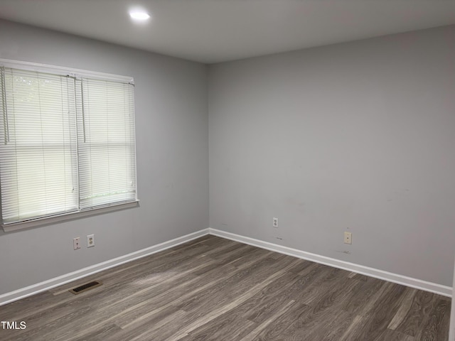 1405 Highview Ct, Raleigh, NC 27606 - empty room with dark wood-style flooring and recessed lighting