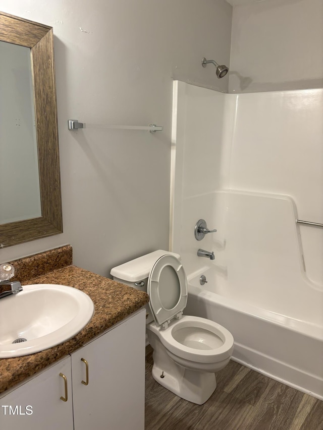 1405 Highview Ct, Raleigh, NC 27606 - full bath featuring vanity, tub / shower combination, and wood finished floors