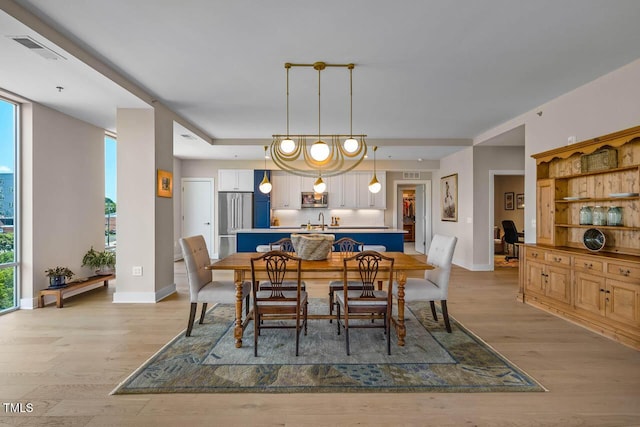 214 Hunt St Unit 503, Durham, NC 27701 - dining space featuring light wood-style floors and baseboards