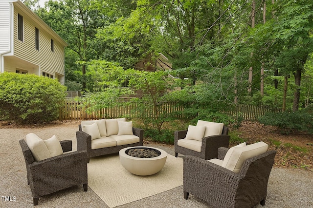 112 W Skyhawk Dr, Cary, NC 27519 - fenced backyard featuring a patio area and an outdoor living space with a fire pit