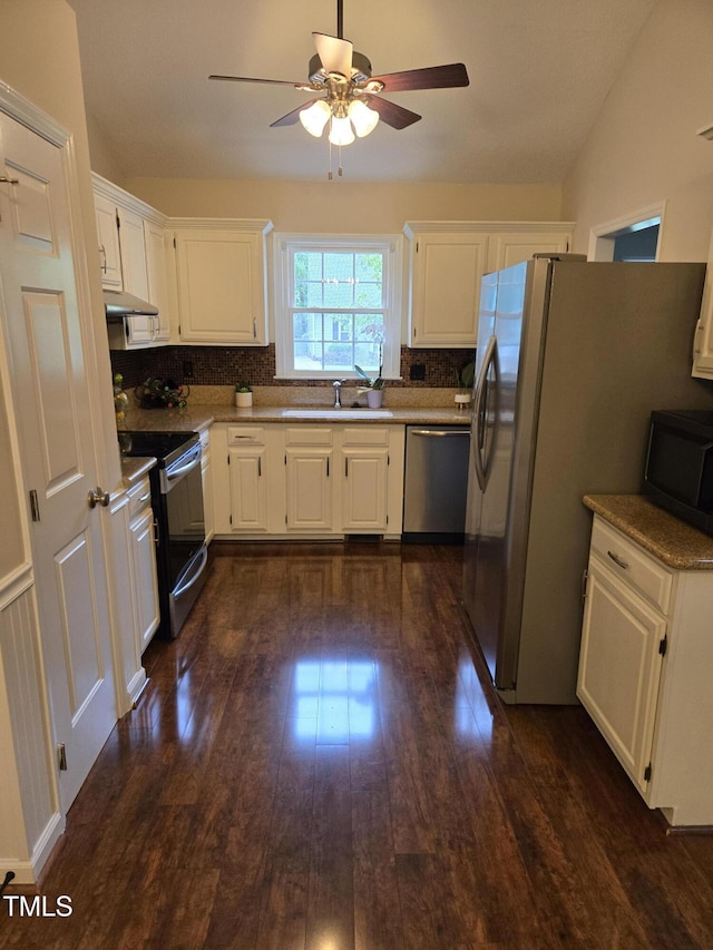112 W Skyhawk Dr, Cary, NC 27519 - kitchen featuring appliances with stainless steel finishes, ceiling fan, dark wood finished floors, tasteful backsplash, and white cabinets