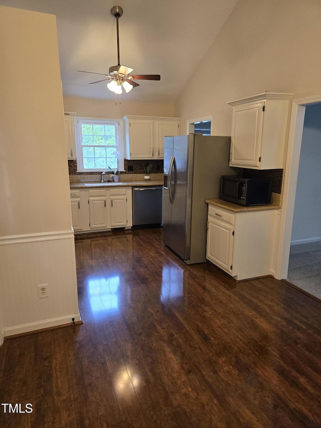 112 W Skyhawk Dr, Cary, NC 27519 - kitchen featuring appliances with stainless steel finishes, a ceiling fan, white cabinets, tasteful backsplash, and high vaulted ceiling