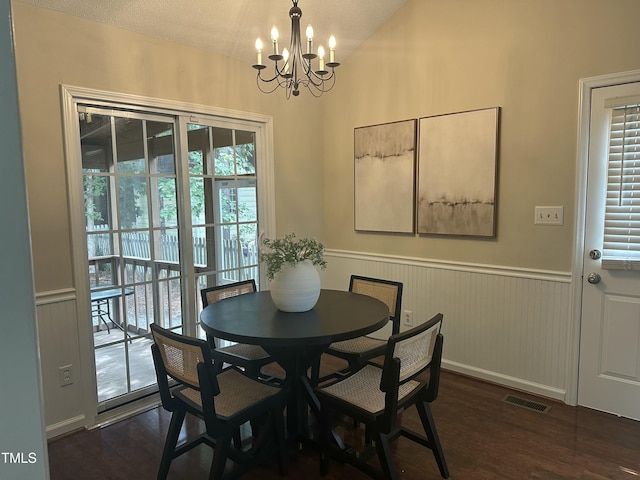 112 W Skyhawk Dr, Cary, NC 27519 - dining area featuring a chandelier, a wainscoted wall, and dark wood-style floors