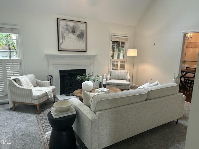 112 W Skyhawk Dr, Cary, NC 27519 - living room with carpet floors, lofted ceiling, a fireplace, and a chandelier