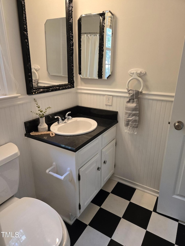112 W Skyhawk Dr, Cary, NC 27519 - full bath with a wainscoted wall, tile patterned floors, and vanity