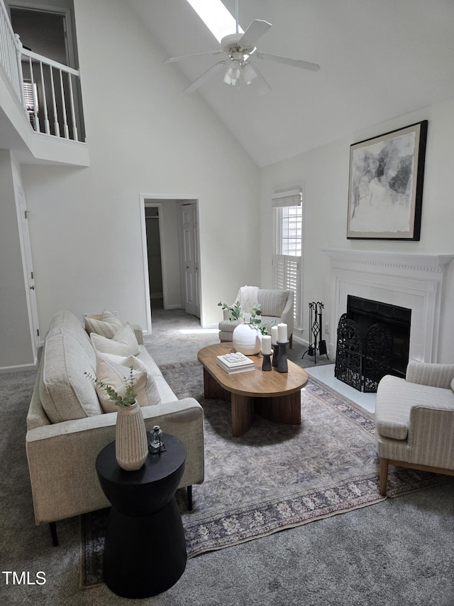 112 W Skyhawk Dr, Cary, NC 27519 - living area with high vaulted ceiling, carpet flooring, ceiling fan, and a fireplace with flush hearth