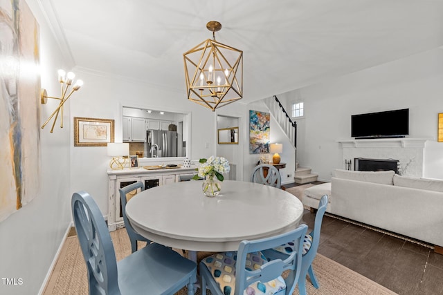 1300 Dylan Heath Ct, Raleigh, NC 27608 - dining room featuring a chandelier, stairs, light wood-style floors, and ornamental molding