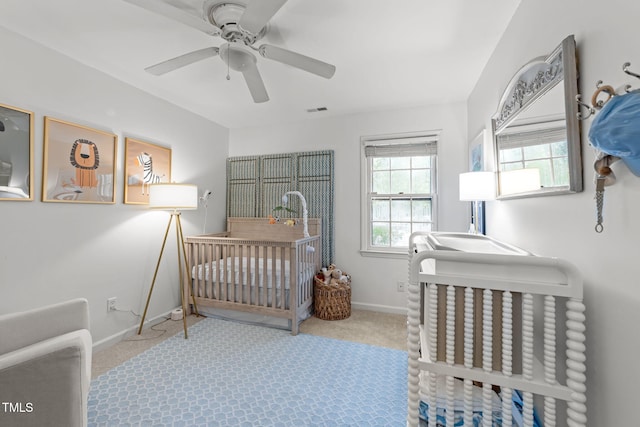 1300 Dylan Heath Ct, Raleigh, NC 27608 - carpeted bedroom featuring ceiling fan and a nursery area