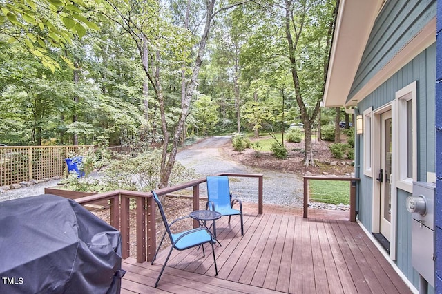 1026 Highland Woods Rd, Chapel Hill, NC 27517 - wooden deck featuring a grill and view of scattered trees