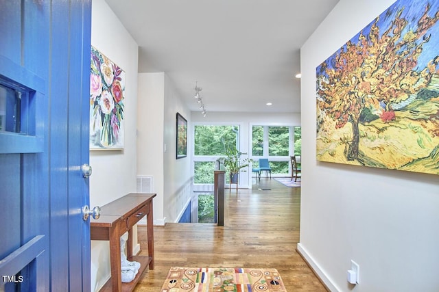 1026 Highland Woods Rd, Chapel Hill, NC 27517 - hallway with wood finished floors, recessed lighting, and an upstairs landing
