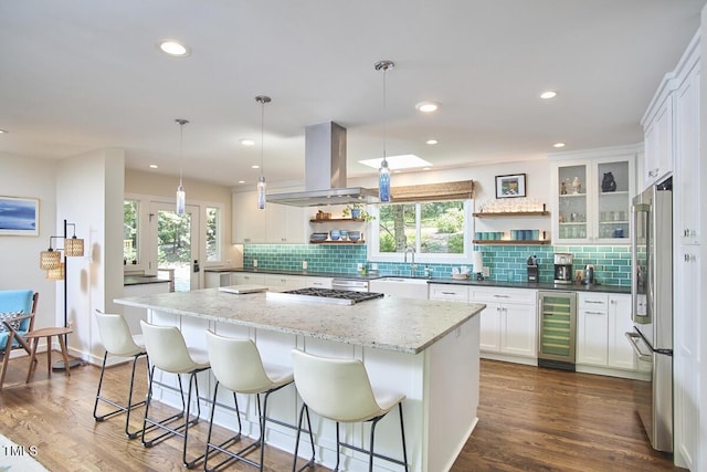 1026 Highland Woods Rd, Chapel Hill, NC 27517 - kitchen with beverage cooler, open shelves, island range hood, plenty of natural light, and recessed lighting