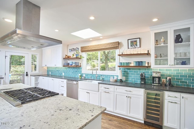 1026 Highland Woods Rd, Chapel Hill, NC 27517 - kitchen with open shelves, wine cooler, island exhaust hood, appliances with stainless steel finishes, and white cabinets