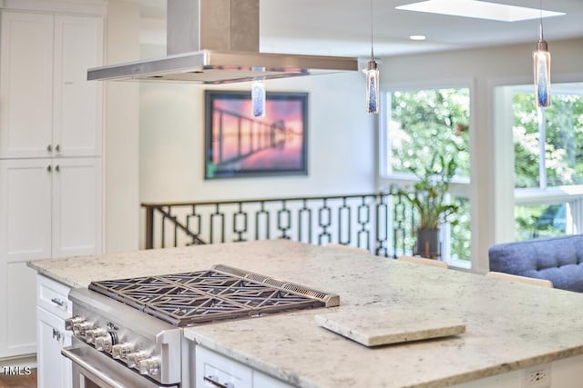 1026 Highland Woods Rd, Chapel Hill, NC 27517 - kitchen featuring high end stove, island exhaust hood, a skylight, and white cabinetry