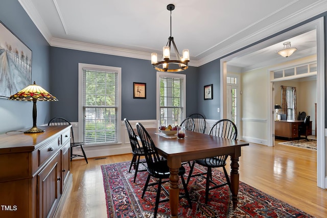 1224 Marshall Farm St, Wake Forest, NC 27587 - dining space with a chandelier, light wood-type flooring, ornamental molding, and a wainscoted wall