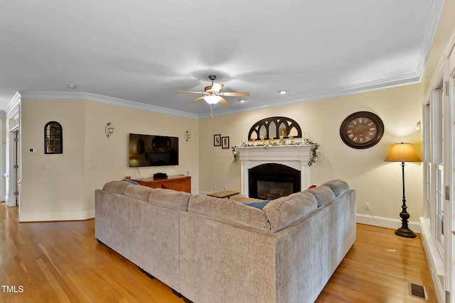 1224 Marshall Farm St, Wake Forest, NC 27587 - living room with ceiling fan, a fireplace, light wood finished floors, and crown molding