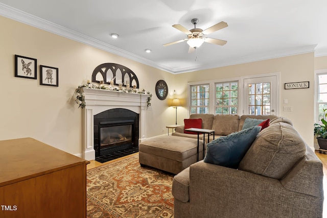 1224 Marshall Farm St, Wake Forest, NC 27587 - living room featuring crown molding, ceiling fan, a fireplace with flush hearth, and light wood finished floors