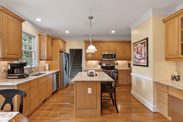 1224 Marshall Farm St, Wake Forest, NC 27587 - kitchen featuring appliances with stainless steel finishes, a center island, a breakfast bar, decorative backsplash, and light wood-style flooring