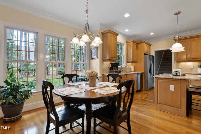 1224 Marshall Farm St, Wake Forest, NC 27587 - dining area with a chandelier, crown molding, light wood-type flooring, recessed lighting, and stairway