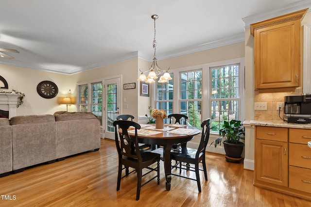 1224 Marshall Farm St, Wake Forest, NC 27587 - dining space featuring a chandelier, light wood finished floors, ornamental molding, and a ceiling fan
