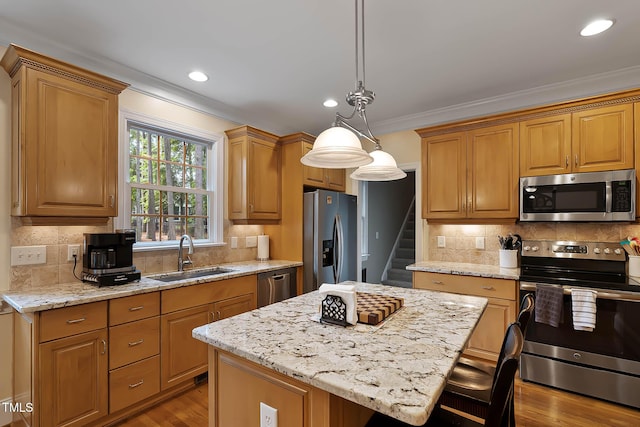 1224 Marshall Farm St, Wake Forest, NC 27587 - kitchen with appliances with stainless steel finishes, crown molding, light stone counters, tasteful backsplash, and a kitchen island