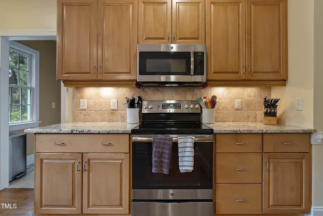 1224 Marshall Farm St, Wake Forest, NC 27587 - kitchen with appliances with stainless steel finishes, tasteful backsplash, and light stone counters