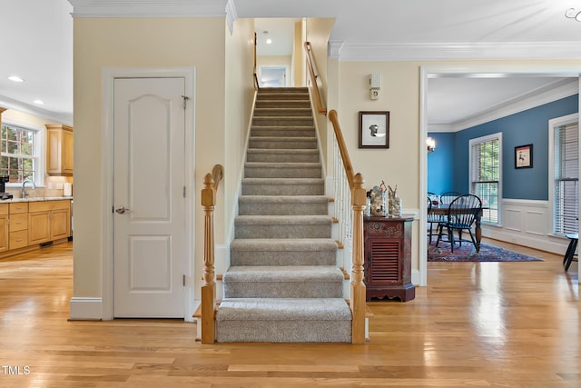 1224 Marshall Farm St, Wake Forest, NC 27587 - staircase with healthy amount of natural light, crown molding, wood finished floors, and recessed lighting