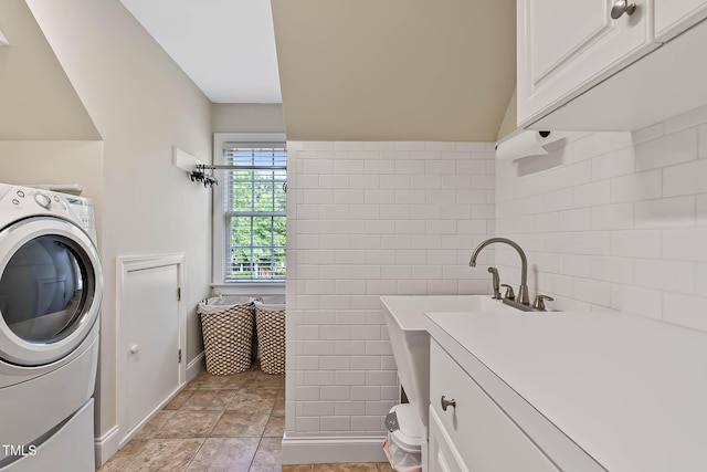 1224 Marshall Farm St, Wake Forest, NC 27587 - washroom featuring washer / dryer, cabinet space, and tile walls