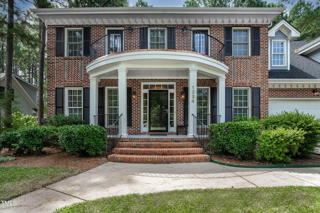 1224 Marshall Farm St, Wake Forest, NC 27587 - georgian-style home with brick siding, a garage, and covered porch