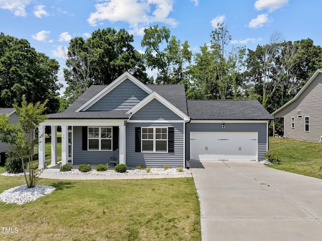 36 Mae Ct, Roxboro, NC 27573 - view of front of property featuring an attached garage, a front lawn, concrete driveway, and roof with shingles