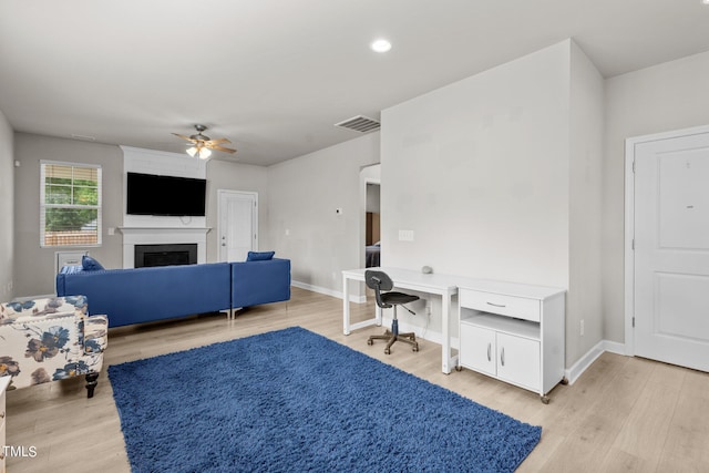 36 Mae Ct, Roxboro, NC 27573 - home office featuring a ceiling fan, light wood-type flooring, a fireplace, and recessed lighting