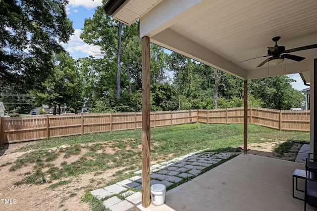 36 Mae Ct, Roxboro, NC 27573 - fenced backyard with a patio, ceiling fan, and view of wooded area