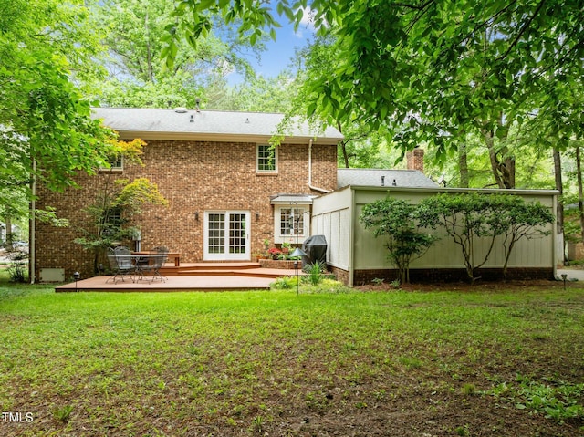 906 Grove St, Chapel Hill, NC 27517 - rear view of property featuring a yard, a chimney, french doors, and a deck