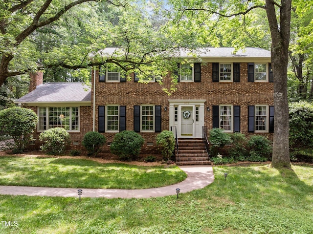 906 Grove St, Chapel Hill, NC 27517 - colonial home featuring brick siding and a front yard