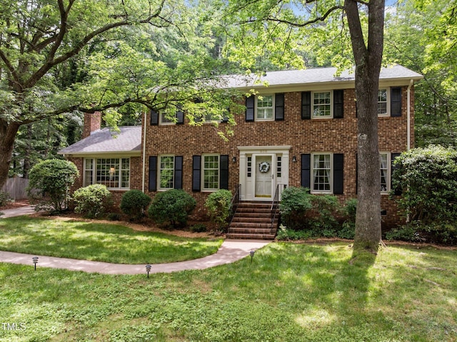 906 Grove St, Chapel Hill, NC 27517 - colonial inspired home with a front yard and brick siding