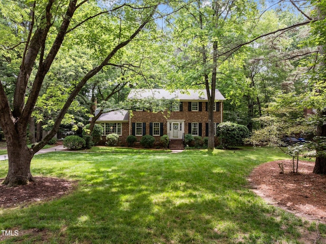 906 Grove St, Chapel Hill, NC 27517 - colonial-style house with brick siding and a front lawn