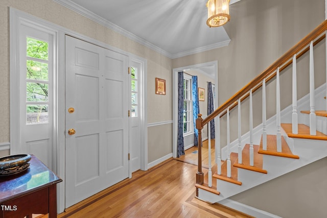 906 Grove St, Chapel Hill, NC 27517 - foyer entrance featuring crown molding, wood finished floors, and stairway