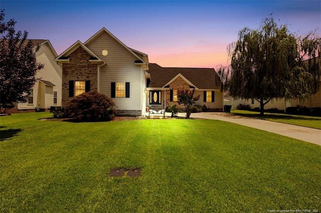 3313 Geyser Peak Rd, Fayetteville, NC 28306 - traditional home featuring a front yard and brick siding