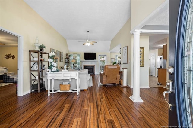 3313 Geyser Peak Rd, Fayetteville, NC 28306 - living area with a ceiling fan, decorative columns, a fireplace, wood finished floors, and vaulted ceiling