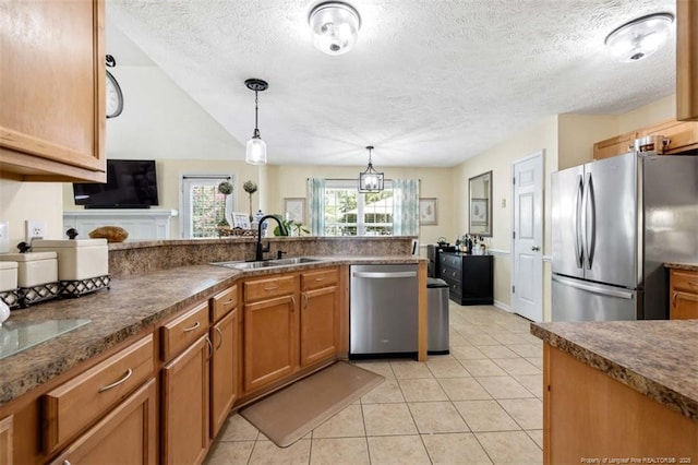 3313 Geyser Peak Rd, Fayetteville, NC 28306 - kitchen featuring stainless steel appliances, dark countertops, a textured ceiling, brown cabinets, and light tile patterned floors