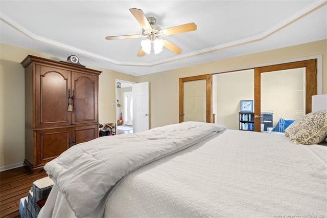 3313 Geyser Peak Rd, Fayetteville, NC 28306 - bedroom featuring dark wood finished floors, a raised ceiling, a ceiling fan, and ornamental molding